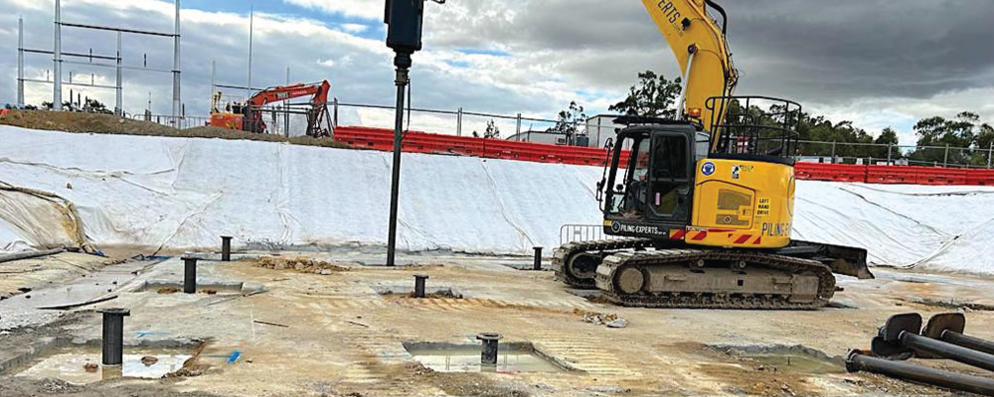 Ground Screws the Future of Infrastructure Development illustrated in a construction site with a crane and a machine.