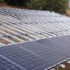 Solar panels on a residential roof, providing clean energy. Groundscrew installation for solar fencing.